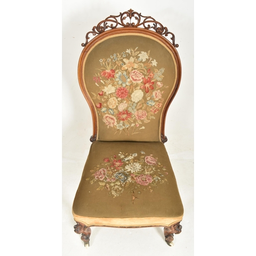 329 - An oversized 19th century mahogany farmed & needlepoint upholstered lady's armchair. The chair h... 