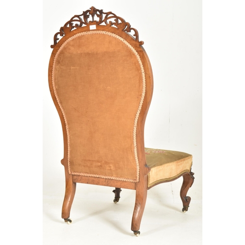 329 - An oversized 19th century mahogany farmed & needlepoint upholstered lady's armchair. The chair h... 