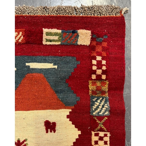 336 - A 20th century South West Persian Islamic Qashgai Kilim floor carpet rug. The rug having a central s... 