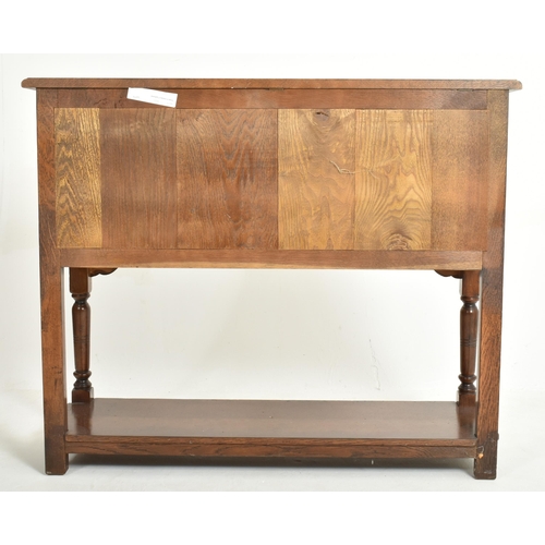 338 - A 20th century George III Revival oak Ipswich credence cupboard - sideboard. The credence having a f... 