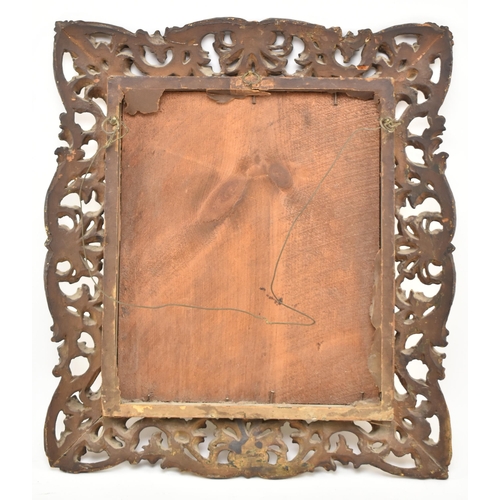 350 - An Italian 19th century Florentine gilt wood & gesso wall mirror. The mirror frame intricately c... 