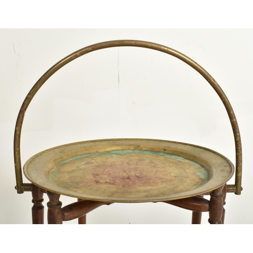 355 - An Anglo-Colonian early 20th century mahogany & brass two tier cake stand / dumbwaiter. The tabl... 