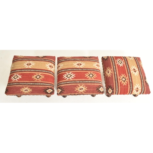 367 - A set of three Indian Zanskar Kilim footstools / seats. Each with multi-coloured padded Kilim rug to... 