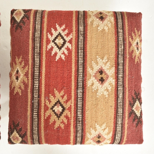 367 - A set of three Indian Zanskar Kilim footstools / seats. Each with multi-coloured padded Kilim rug to... 