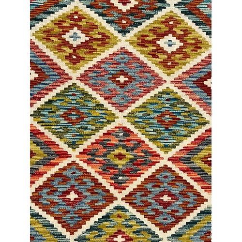 368 - A 20th century Anatolian Turkish Kilim floor carpet runner rug. The runner rug having a central pane... 