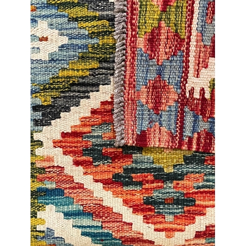 368 - A 20th century Anatolian Turkish Kilim floor carpet runner rug. The runner rug having a central pane... 