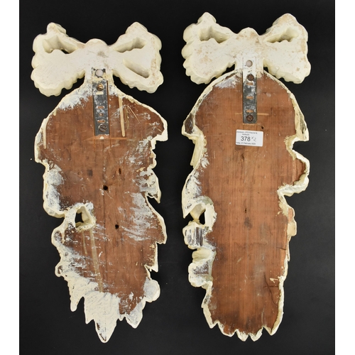 378 - A pair of late 18th century carved oak & gesso wall embellishments. The wall appliques carved wi... 