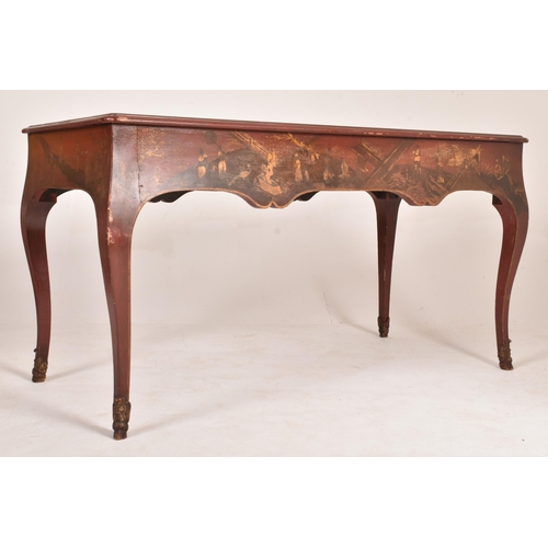 385 - An early 20th century Chinoiserie red lacquered writing desk table. The table having a rectangular t... 