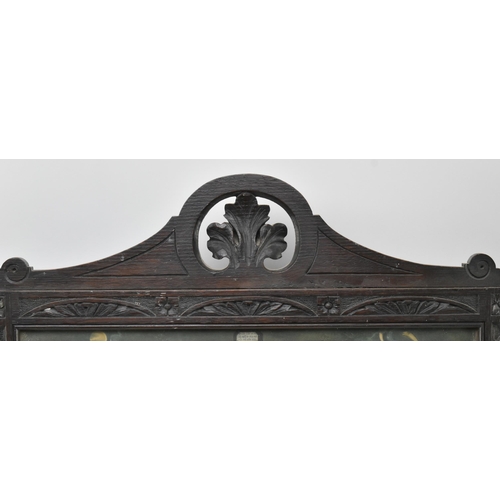 401 - An early 20th century carved wood & glazed front triptych floor panel screen. The wooden frames ... 