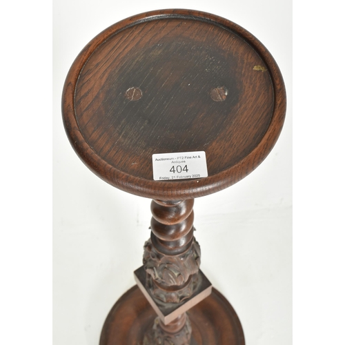 404 - A 19th century carved mahogany barely twist torchere plant stand. The pedestal having a circular top... 