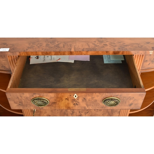 412 - Titchmarsh & Goodwin - a George III Revival yew wood bow front sideboard credenza. The sideboard... 