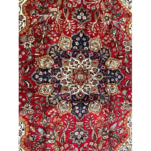 416 - A large early 20th century North West Persian Islamic Tabirz floor carpet rug. The carpet having a c... 