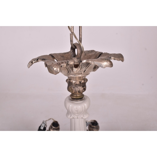 423 - A mid century Italian chrome and ceramic four branch chandelier electrolier. The pendent ceiling lig... 