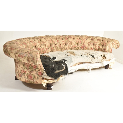 438 - A large 19th century high Victorian crescent shaped Chesterfield sofa settee in the manner of Howard... 