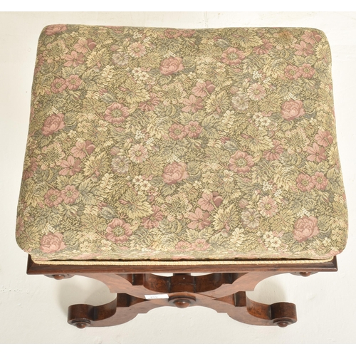 452 - A late 19th century mahogany & upholstered X-framed stool / piano seat. The stool having a padde... 