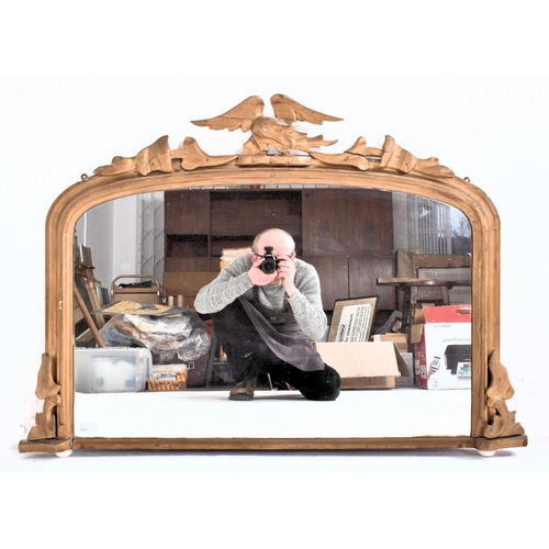 454 - A French inspired 19th century giltwood & gesso overmantel ornate wall mirror. The mirror having... 