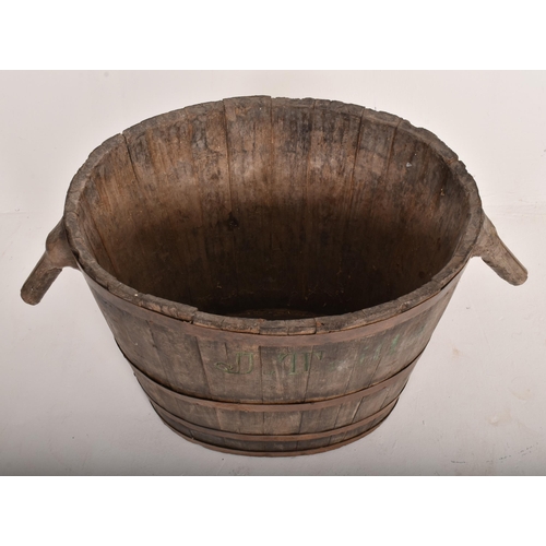 470 - A large French 19th century oak & metal bound harvest grape bucket / barrel. The bucket of oval ... 