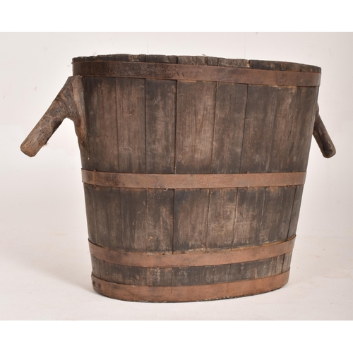 470 - A large French 19th century oak & metal bound harvest grape bucket / barrel. The bucket of oval ... 