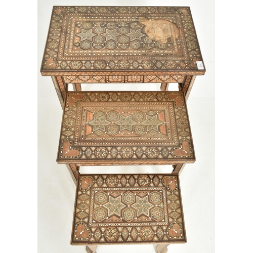 483 - A Syrian 20th century 'Damascus' inlaid nest of three graduating tables. Each having a rectangular t... 