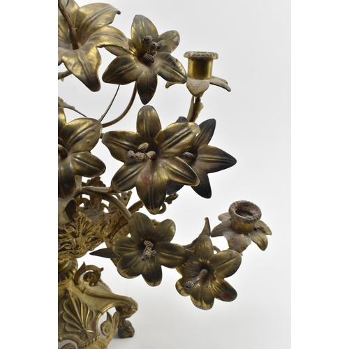 493 - A large 19th century French Empire toleware gilt metal candelabra. The centrepiece featuring floral ... 