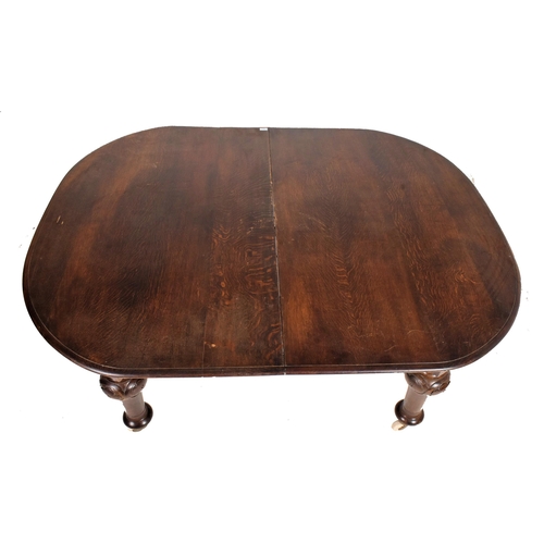 494 - A large 19th century mahogany extending dining table. The table having a rectangular top with curved... 