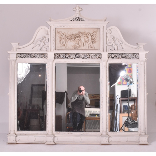 496 - A large 20th century over-painted triptych mirror. Decorative carved frame throughout with an elabor... 