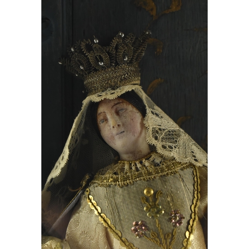 500 - A continental 19th century mahogany & glazed cased chapel ecclesiastical wax figure of Madonna w... 