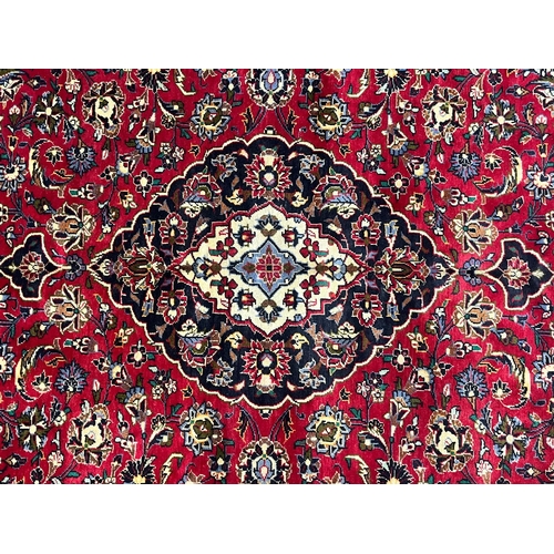 503 - An early 20th century Central Persian Islamic Kashan floor carpet rug. The rug having a central meda... 