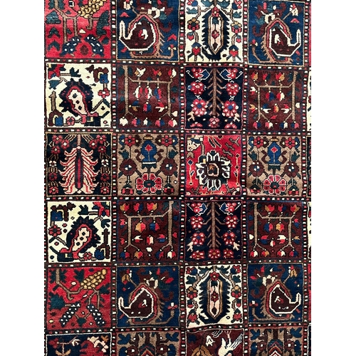 518 - An early 20th century Central Persian Islamic Bakhtiar floor carpet rug. The rug having a central pa... 