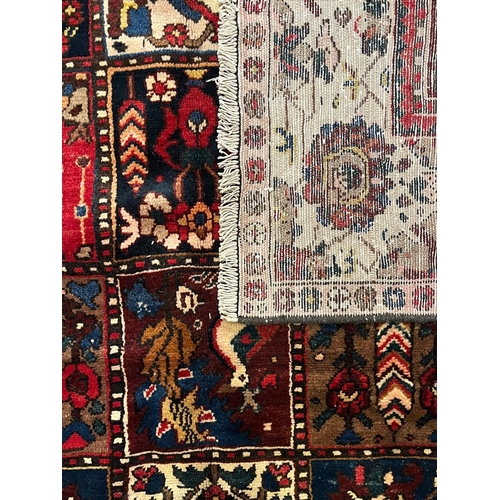 518 - An early 20th century Central Persian Islamic Bakhtiar floor carpet rug. The rug having a central pa... 