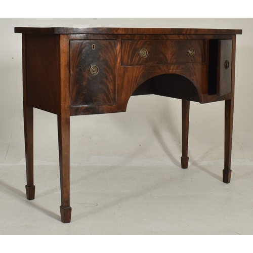 519 - A George III early 19th century mahogany bow fronted credenza dresser. The sideboard having a flared... 