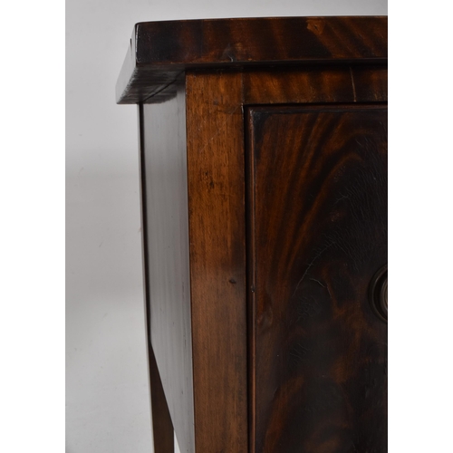 519 - A George III early 19th century mahogany bow fronted credenza dresser. The sideboard having a flared... 