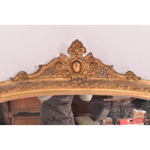 539 - A large Victorian 19th century giltwood and gesso overmantel wall mirror. The mirror having an intri... 