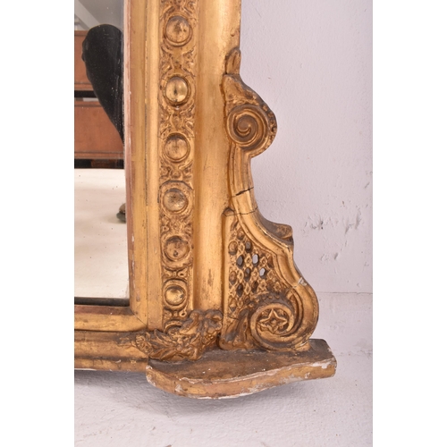 539 - A large Victorian 19th century giltwood and gesso overmantel wall mirror. The mirror having an intri... 