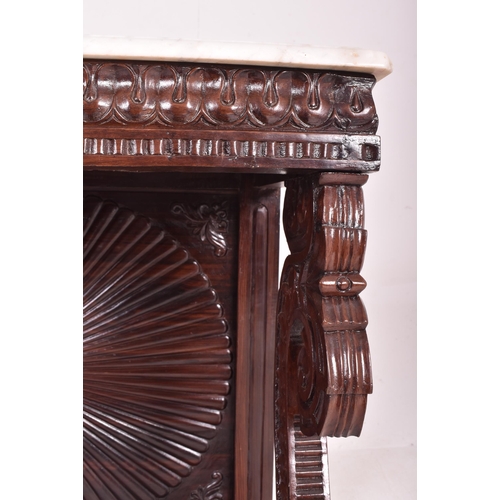 544 - An Anglo - Indian inspired carved hardwood & marble console hall table with marble top in the ma... 