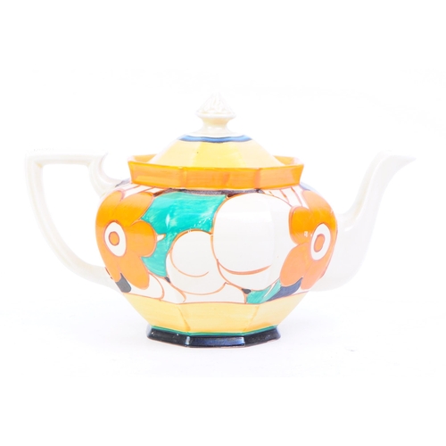 107 - Clarice Cliff - An early 20th century 1930s Clarice Cliff Fantasque teapot. The teapot cream ground ... 