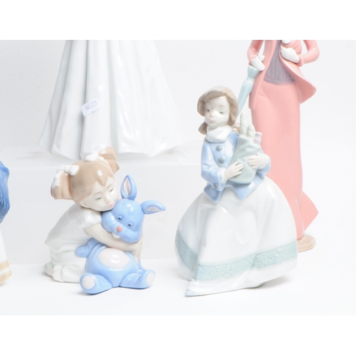 11 - Lladro, Nao - Collection of hand made Spanish porcelain figurines. To include a large Bride in a wed... 