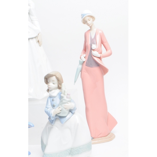 11 - Lladro, Nao - Collection of hand made Spanish porcelain figurines. To include a large Bride in a wed... 