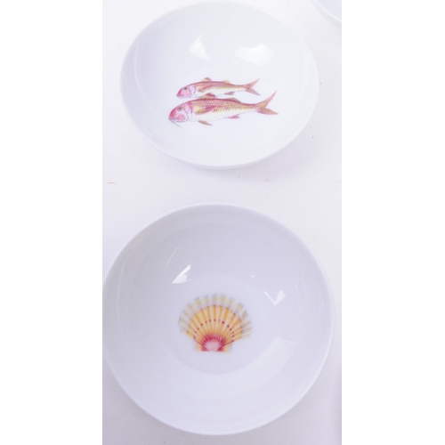 125 - De Limoges - Eight French Richard Bramble porcelain small seafood dishes each decorated with a diffe... 