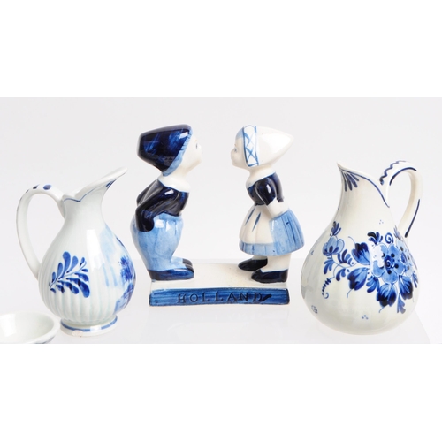 129 - Collection of 20th century Dutch Delft ware pottery pieces. Including boy and girl statues, jugs, be... 