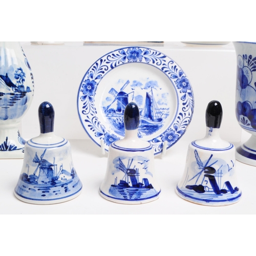 129 - Collection of 20th century Dutch Delft ware pottery pieces. Including boy and girl statues, jugs, be... 