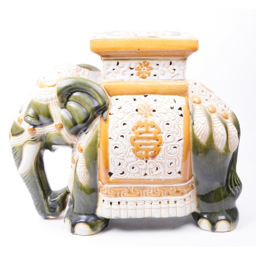 144 - Large vintage 20th century ceramic jardiniere plant stand in the form of an elephant. The jardiniere... 