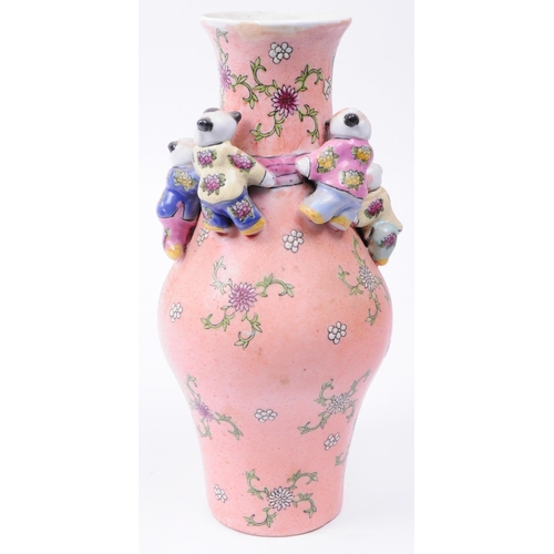 164 - Early 20th century porcelain Chinese Macau fertility vase in a pink colourway and decorated in relie... 