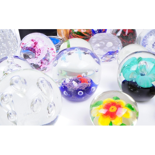 167 - Large collection of late 20th century glass paperweights. Including various sizes and shapes such as... 