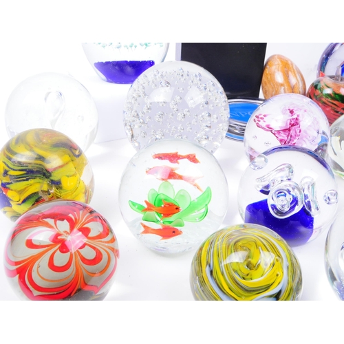 167 - Large collection of late 20th century glass paperweights. Including various sizes and shapes such as... 