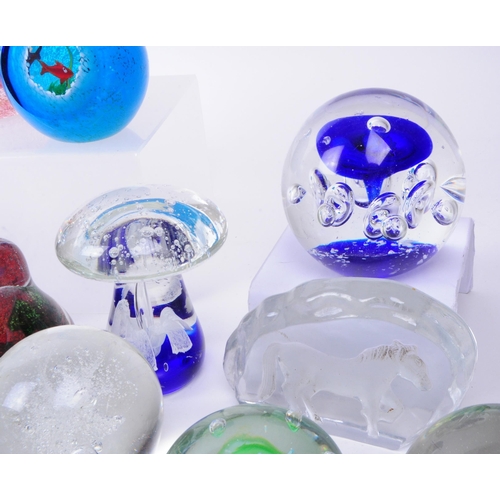 167 - Large collection of late 20th century glass paperweights. Including various sizes and shapes such as... 