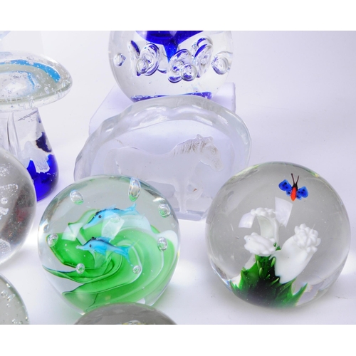 167 - Large collection of late 20th century glass paperweights. Including various sizes and shapes such as... 