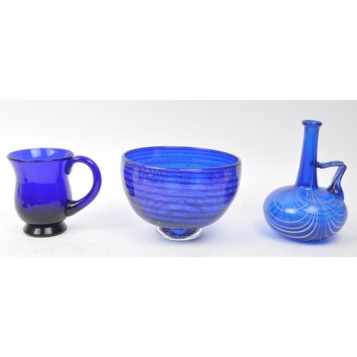 191 - Collection of 20th century Bristol blue glass wares to include decanter, vase, pots, stem vases, mug... 