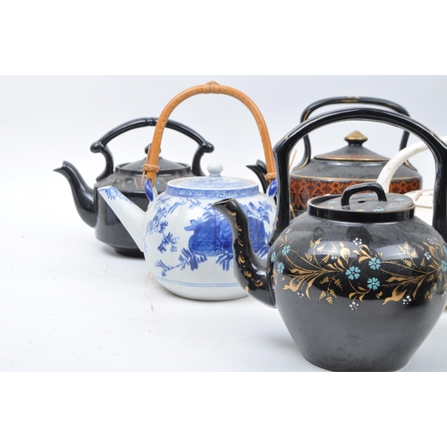 194 - A Large collection of 19th and 20th century ceramica and porcelain teapots to include Aesthetic Move... 