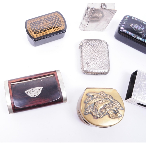 203 - A small collection of 19th and 20th century match cases, snuff boxes, and curios. The collection to ... 